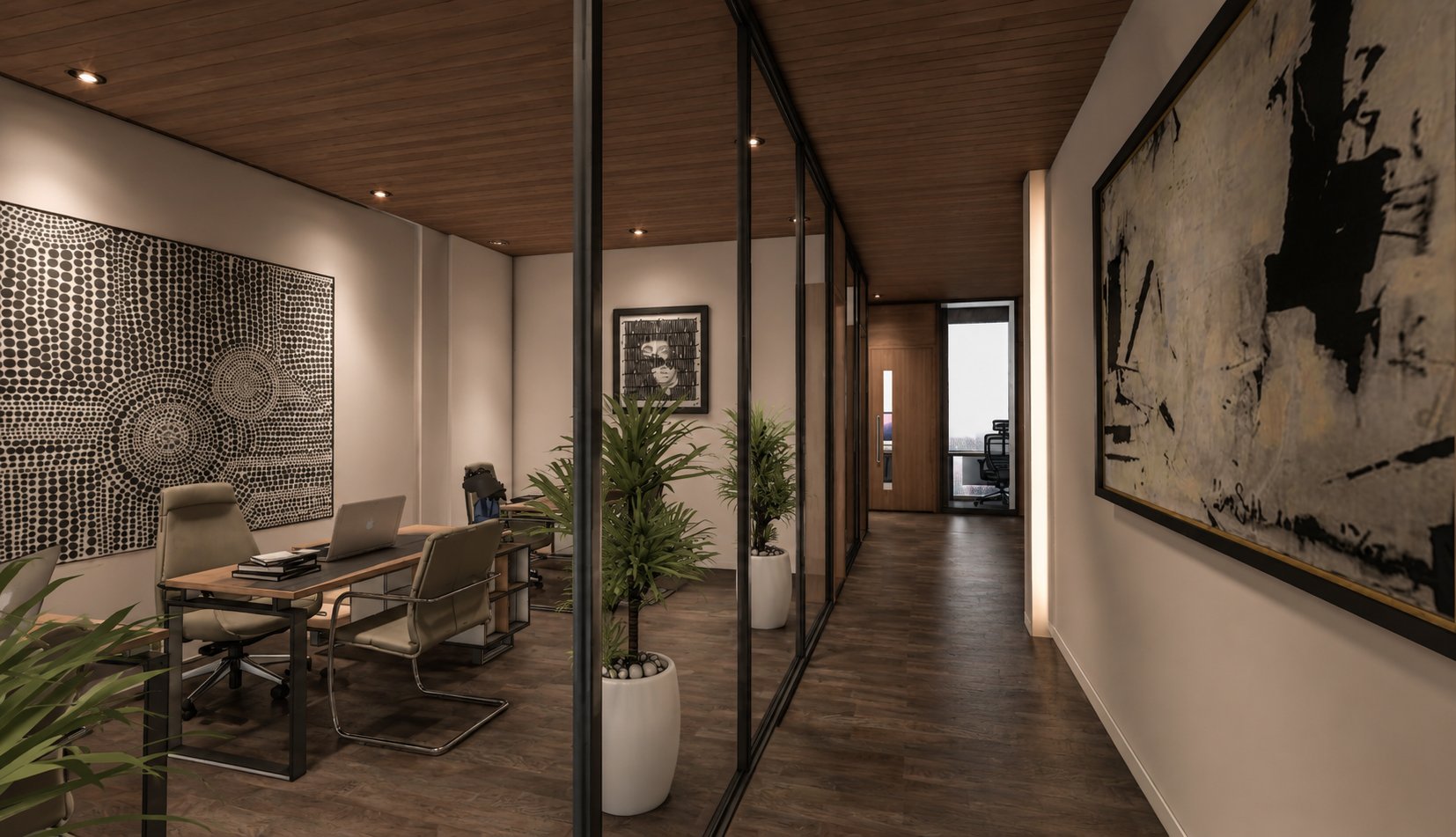 Corridor running alongside glass-walled offices with framed artwork on the right, leading to a walnut door lit by a bright sidelight.